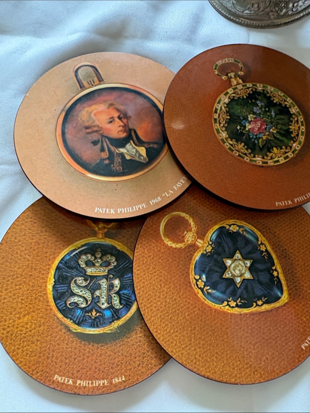 Patek Philippe Brown and Gold Decorative Coaster Set